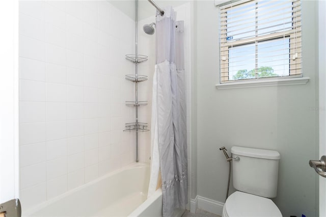 10427 Royal Cypress Way, Orlando, FL 32836 - bathroom featuring toilet and shower / bath combo