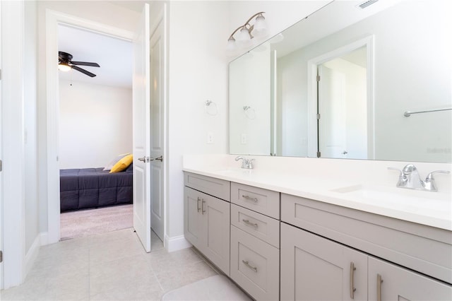 10427 Royal Cypress Way, Orlando, FL 32836 - bathroom featuring double vanity, connected bathroom, tile patterned floors, and ceiling fan