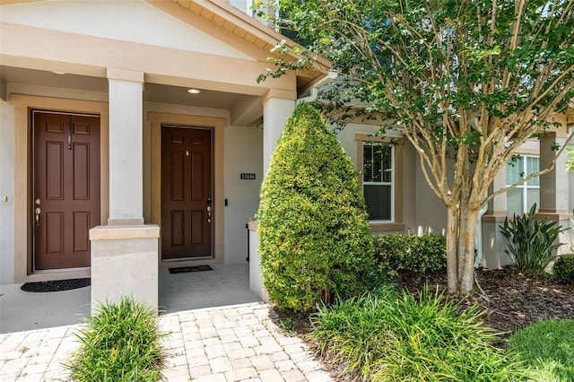 11686 Water Run Aly, Windermere, FL 34786 - view of exterior entry with stucco siding