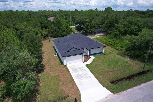 4447 Heyward St, North Port, FL 34291 - aerial view of property and surrounding area featuring a forest