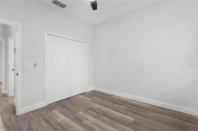4447 Heyward St, North Port, FL 34291 - unfurnished bedroom with wood finished floors, a closet, and ceiling fan