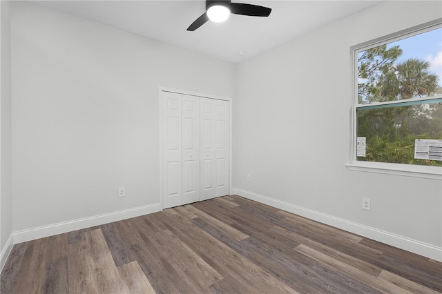 4447 Heyward St, North Port, FL 34291 - unfurnished bedroom with wood finished floors, a closet, and ceiling fan