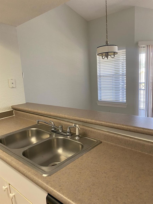 detailed view of a sink and a chandelier