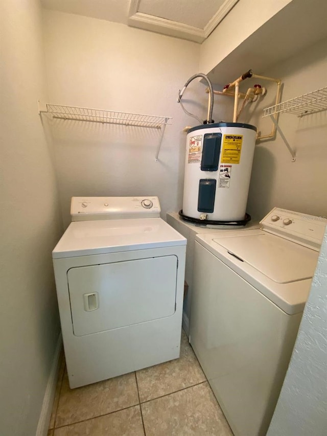 laundry room featuring water heater, independent washer and dryer, and light tile patterned floors