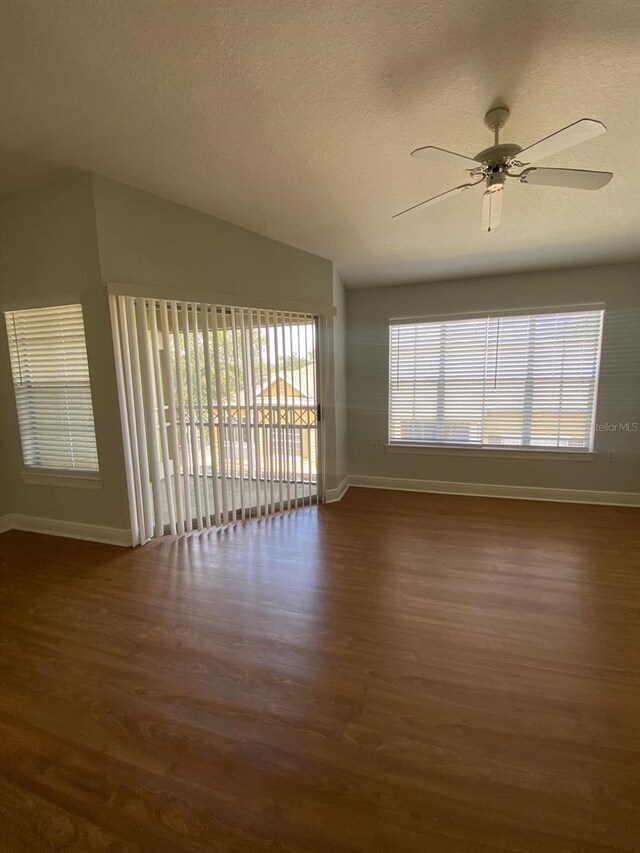unfurnished room with wood finished floors, ceiling fan, and a textured ceiling