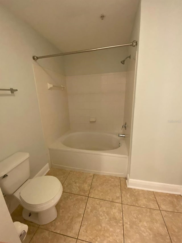 bathroom with tile patterned floors and bathtub / shower combination