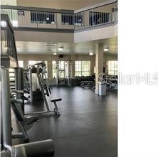 gym with a towering ceiling