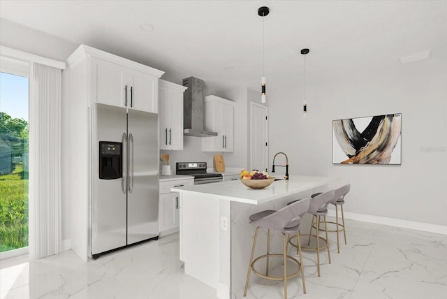 2446 Greenway, Sanford, FL 32771 - kitchen featuring appliances with stainless steel finishes, wall chimney range hood, light marble finish floors, and white cabinets