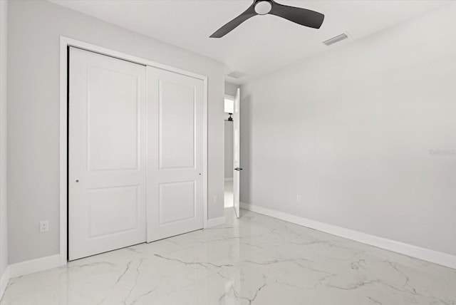 2446 Greenway, Sanford, FL 32771 - unfurnished bedroom with marble finish floors, a closet, and a ceiling fan