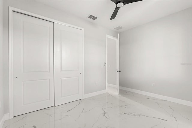 2446 Greenway, Sanford, FL 32771 - unfurnished bedroom featuring light marble finish floors, a closet, and ceiling fan