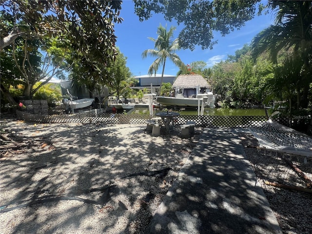 3767 Hibiscus St, Big Pine Key, FL 33043 - view of patio with a boat dock and boat lift