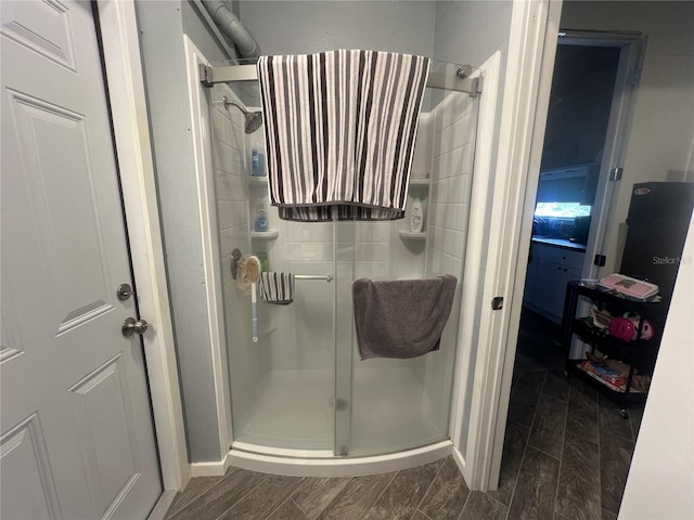 3767 Hibiscus St, Big Pine Key, FL 33043 - bathroom featuring a shower stall and wood finished floors