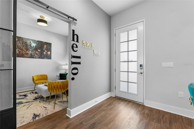 8427 Modiano St, Orlando, FL 32827 - entryway with a barn door and wood finished floors