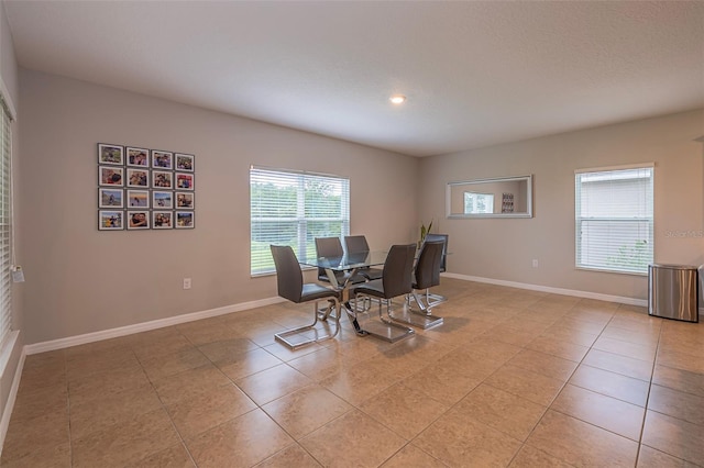 565 Ogelthorpe Dr, Davenport, FL 33897 - dining room with light tile patterned floors and recessed lighting