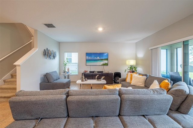 565 Ogelthorpe Dr, Davenport, FL 33897 - tiled living area featuring healthy amount of natural light, stairs, and recessed lighting