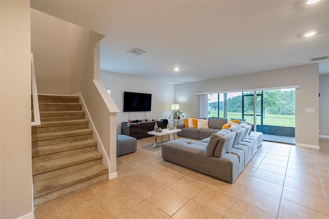 565 Ogelthorpe Dr, Davenport, FL 33897 - living room featuring recessed lighting, light tile patterned floors, and stairs