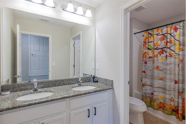 565 Ogelthorpe Dr, Davenport, FL 33897 - full bath with double vanity, tile patterned flooring, and shower / tub combo with curtain