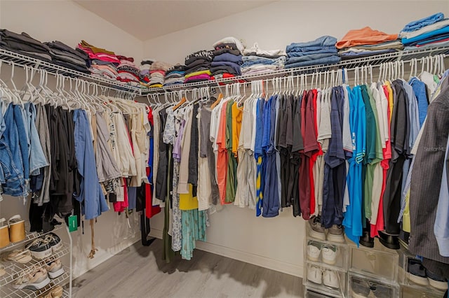 565 Ogelthorpe Dr, Davenport, FL 33897 - spacious closet with wood finished floors