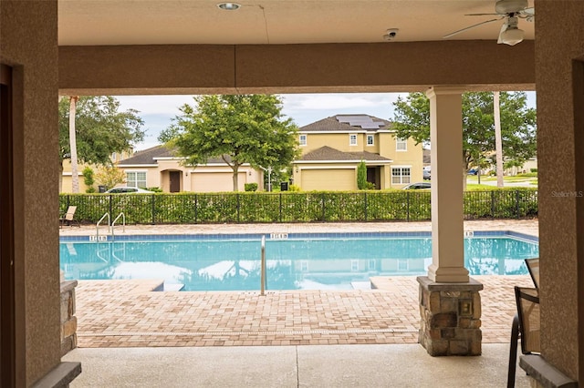 565 Ogelthorpe Dr, Davenport, FL 33897 - community pool with a ceiling fan and a patio area