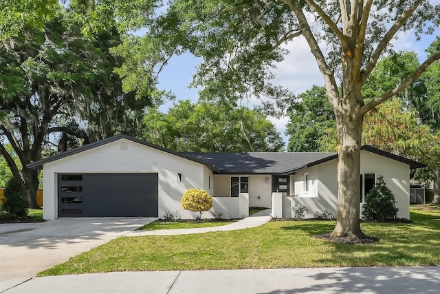 213 W Tilden St, Winter Garden, FL 34787 - ranch-style home featuring a garage, a front yard, driveway, and stucco siding