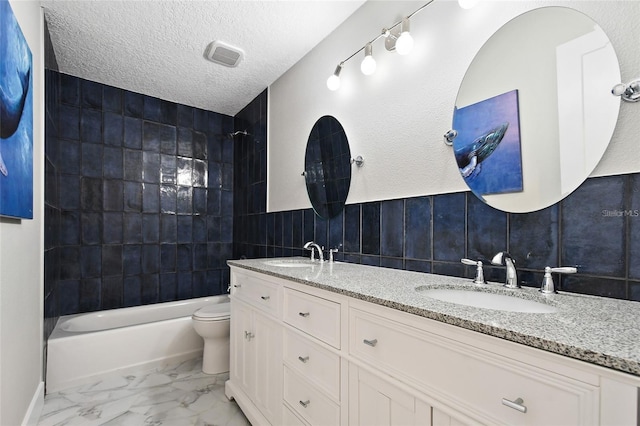 213 W Tilden St, Winter Garden, FL 34787 - bathroom featuring bathing tub / shower combination, double vanity, tile walls, and marble finish flooring