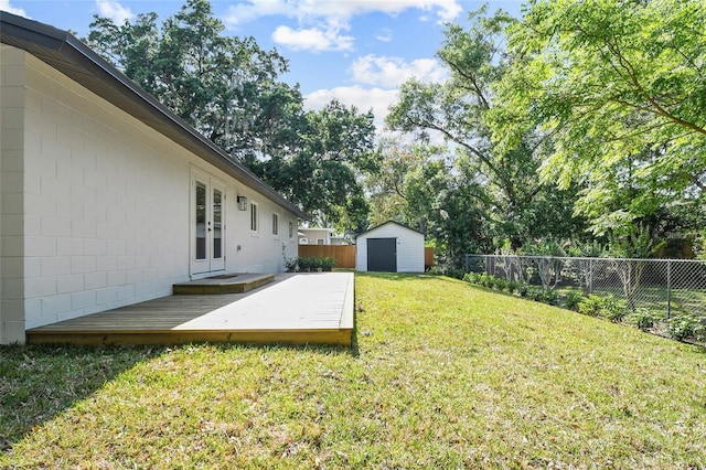 213 W Tilden St, Winter Garden, FL 34787 - fenced backyard with a deck, a shed, and french doors