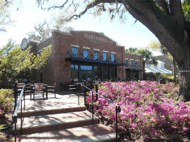 213 W Tilden St, Winter Garden, FL 34787 - back of property with brick siding and a patio area