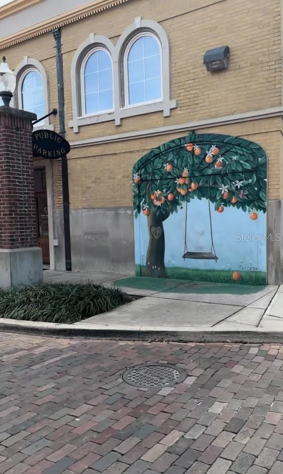 213 W Tilden St, Winter Garden, FL 34787 - doorway to property featuring brick siding