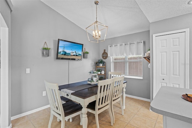 2980 Cool Breeze Cir, Saint Cloud, FL 34769 - dining area with a chandelier, light tile patterned flooring, a textured ceiling, and vaulted ceiling