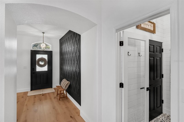 215 Foxglove Way, Deland, FL 32724 - entryway with light wood finished floors and arched walkways