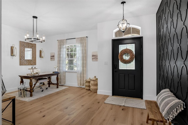 215 Foxglove Way, Deland, FL 32724 - foyer featuring a chandelier and wood finished floors