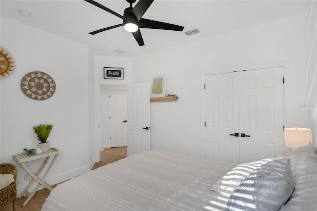 215 Foxglove Way, Deland, FL 32724 - bedroom with a closet, wood finished floors, and ceiling fan