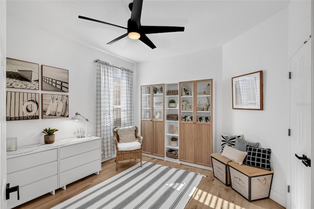215 Foxglove Way, Deland, FL 32724 - living area with ceiling fan and light wood-style flooring