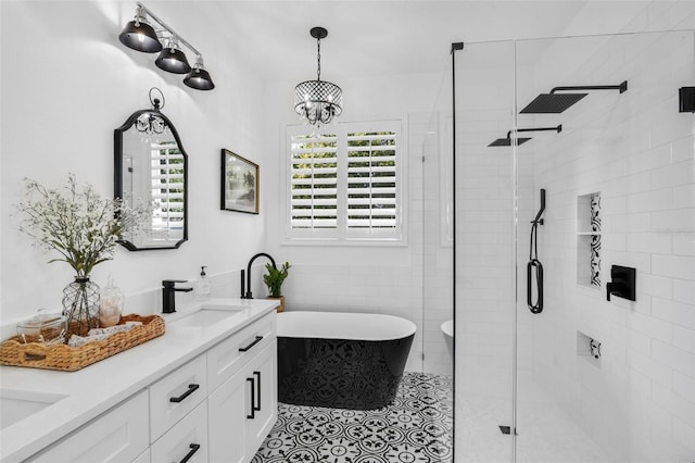 215 Foxglove Way, Deland, FL 32724 - full bath with a shower stall, a soaking tub, double vanity, tile patterned flooring, and a chandelier