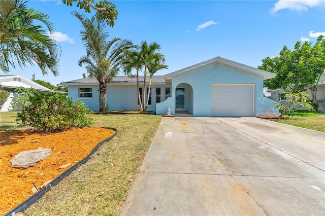 2075 Abalone Ave, Indialantic, FL 32903 - single story home featuring stucco siding, an attached garage, concrete driveway, and a front lawn