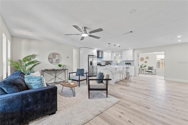 2075 Abalone Ave, Indialantic, FL 32903 - living area with ceiling fan, light wood-style floors, and recessed lighting