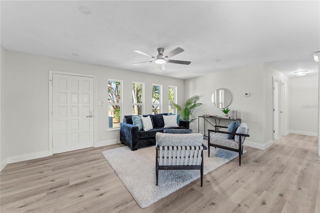 2075 Abalone Ave, Indialantic, FL 32903 - living room with ceiling fan and light wood finished floors
