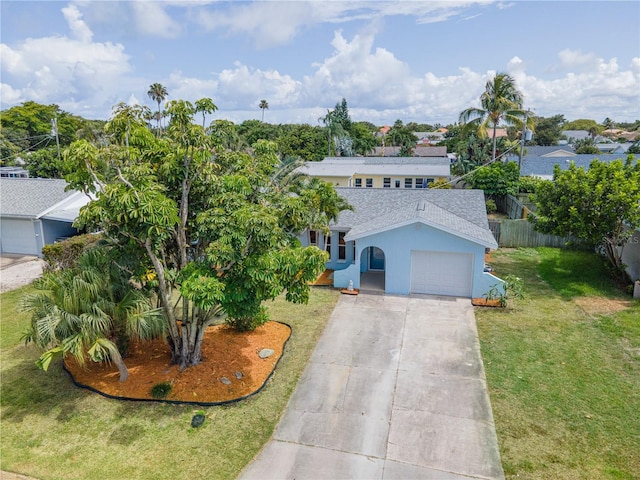 2075 Abalone Ave, Indialantic, FL 32903 - view of front of house featuring a shingled roof, an attached garage, stucco siding, and concrete driveway