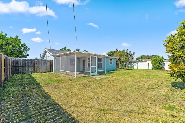 2075 Abalone Ave, Indialantic, FL 32903 - back of property with a sunroom and a fenced backyard