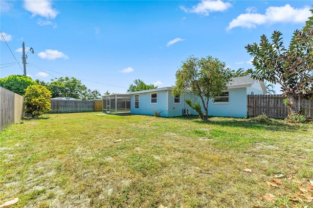 2075 Abalone Ave, Indialantic, FL 32903 - fenced backyard with a sunroom