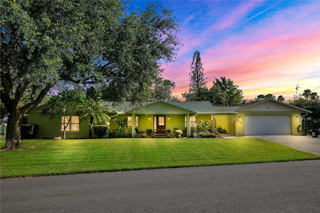 4230 Havana Dr, Cocoa, FL 32927 - ranch-style home with driveway, an attached garage, a front yard, and covered porch