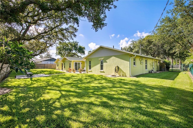 4230 Havana Dr, Cocoa, FL 32927 - back of house with stucco siding and a fenced backyard