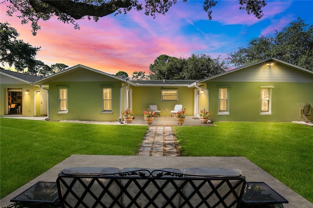 4230 Havana Dr, Cocoa, FL 32927 - back of house at dusk featuring stucco siding