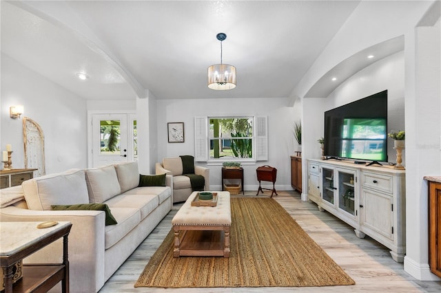4230 Havana Dr, Cocoa, FL 32927 - living room featuring light wood-style flooring, plenty of natural light, a chandelier, recessed lighting, and lofted ceiling