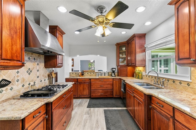 4230 Havana Dr, Cocoa, FL 32927 - kitchen featuring wall chimney exhaust hood, stainless steel gas stovetop, plenty of natural light, light stone counters, and recessed lighting