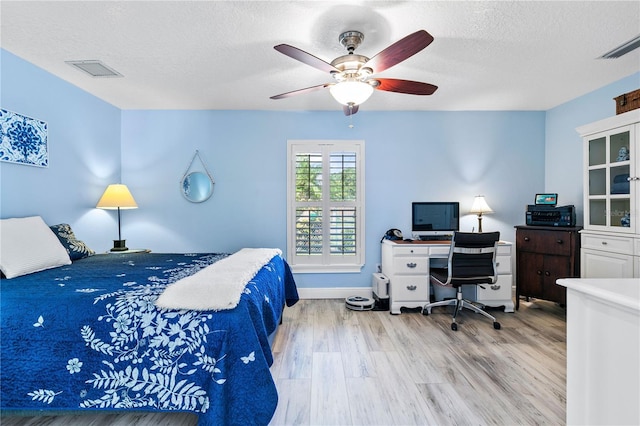 4230 Havana Dr, Cocoa, FL 32927 - bedroom with wood finished floors, a textured ceiling, an office area, and ceiling fan