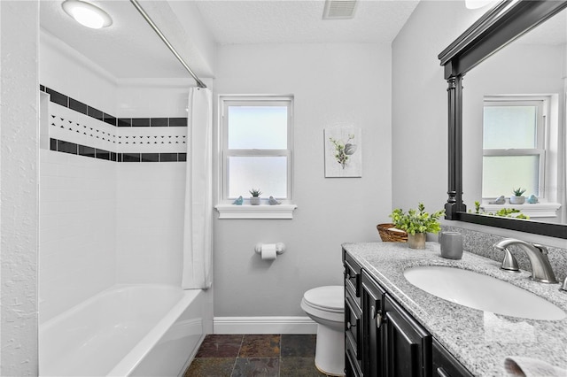 4230 Havana Dr, Cocoa, FL 32927 - bathroom featuring vanity, shower / bath combination with curtain, stone finish flooring, and a textured ceiling
