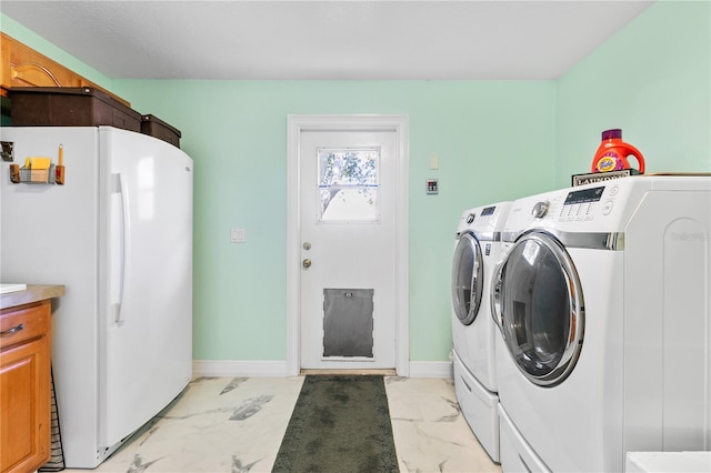 4230 Havana Dr, Cocoa, FL 32927 - laundry area with light marble finish flooring and washer and dryer