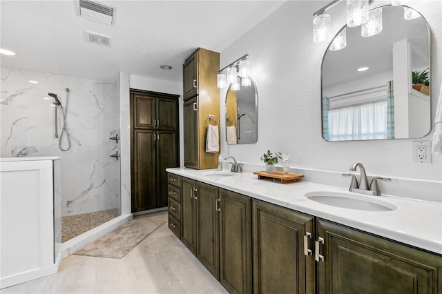 4230 Havana Dr, Cocoa, FL 32927 - full bathroom featuring double vanity, a marble finish shower, and a textured ceiling