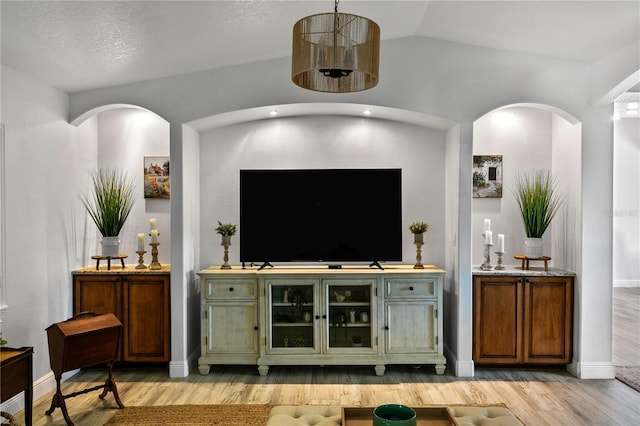 4230 Havana Dr, Cocoa, FL 32927 - living room featuring light wood finished floors and arched walkways
